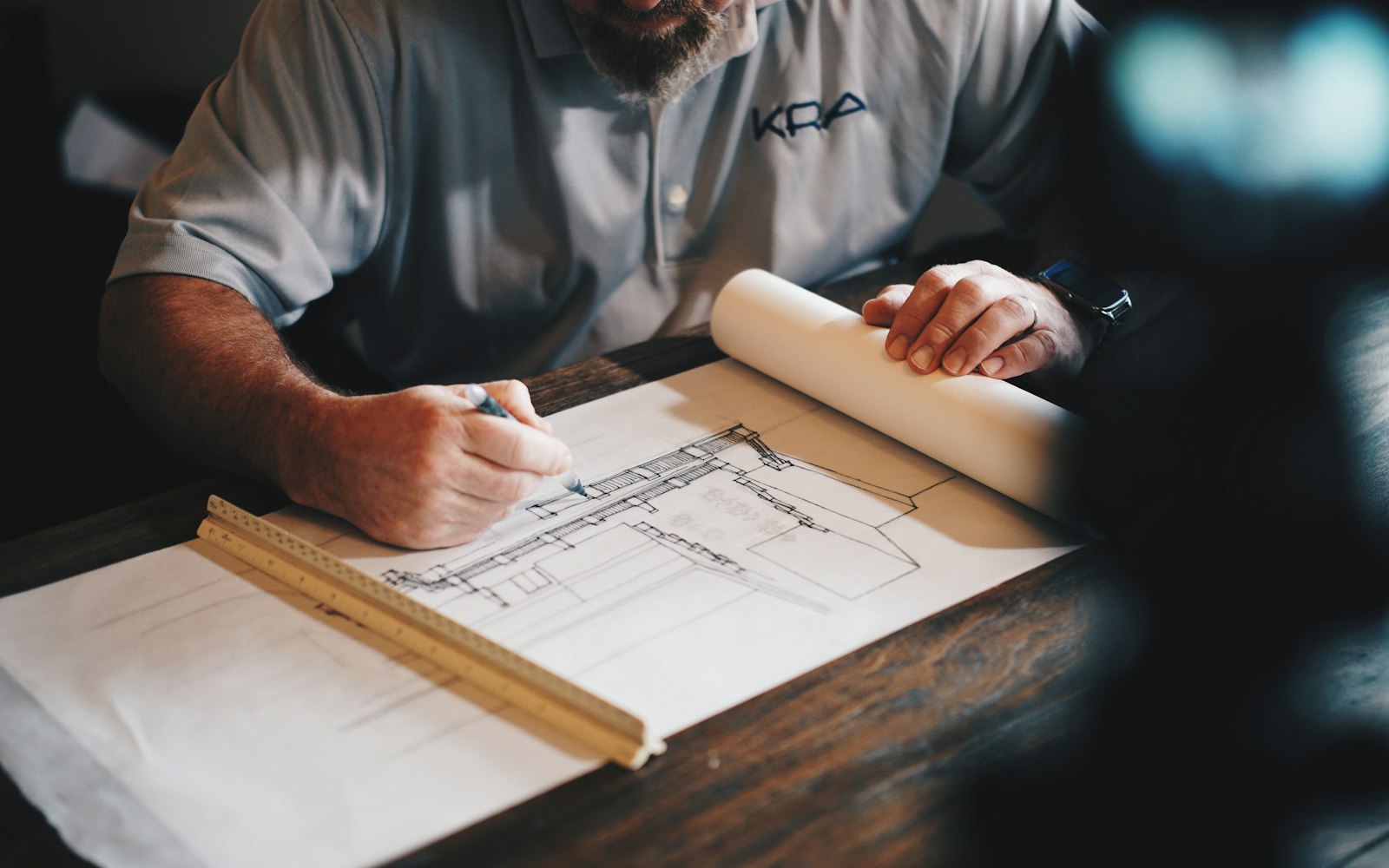 Construction professional using a tablet to review project information on site